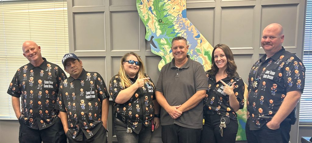 Twin Day at LAC in Lancaster with staff wearing matching shirts emblazoned with images of the warden and chief deputy warden.