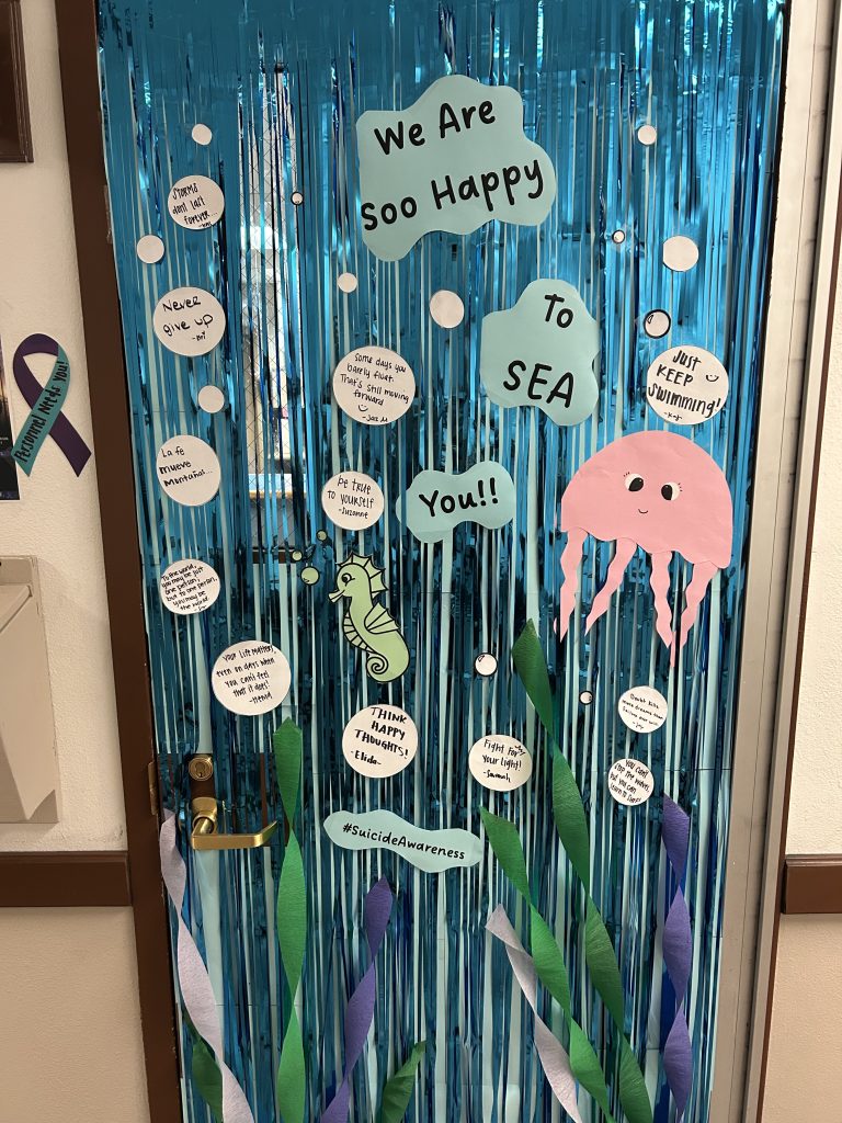 Ocean-themed decorated door in LAC for Suicide Awareness Month.