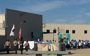 The NKSP Honor Guard leads the suicide prevention walk with staff, leadership and the incarcerated population.