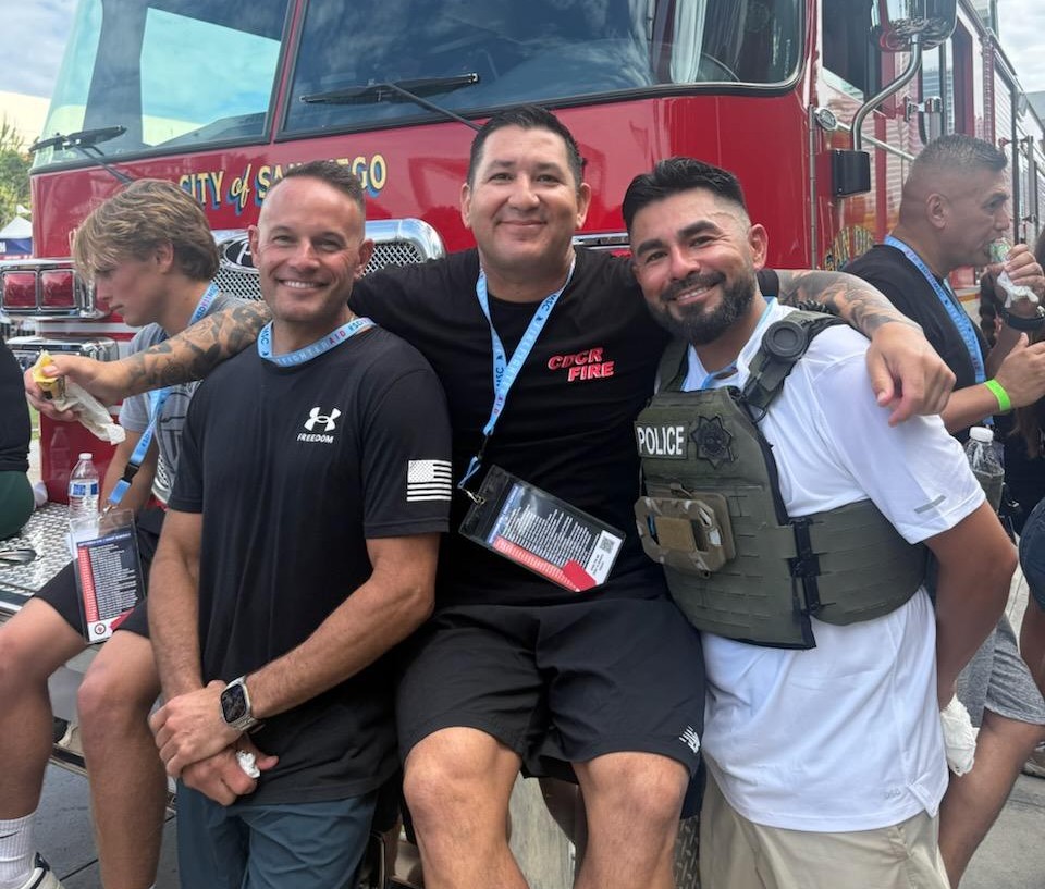 Staff from RJD leaning against a fire engine.
