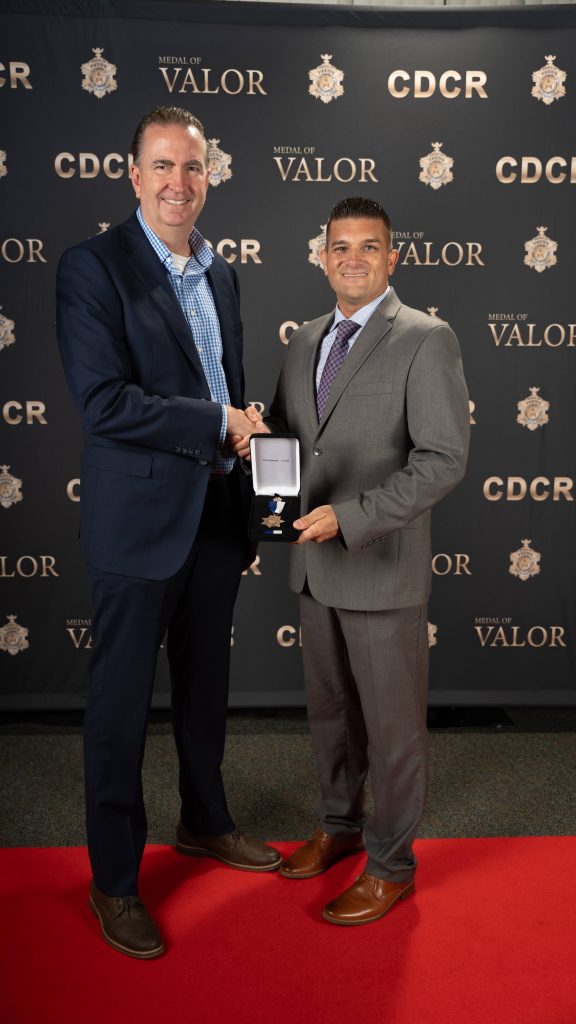 An honoree with Secretary Macomber 2026.