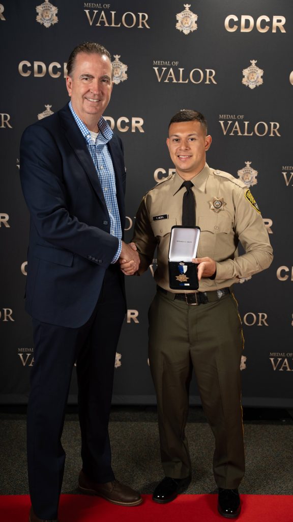 Gold star honoree with Secretary Macomber at the MOV 2026.