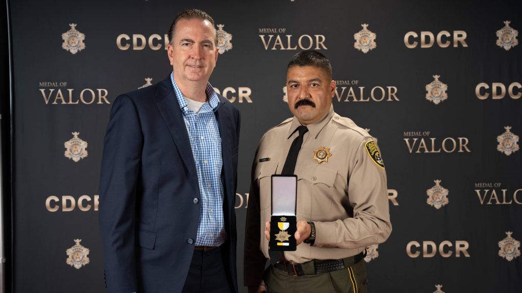 Officer Olmos and Secretary Macomber 2026 MOV ceremony.