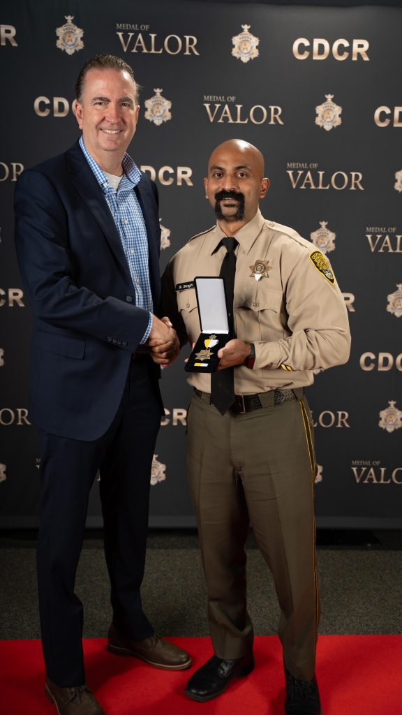Officer Sandeep Singh and Secretary Macomber.