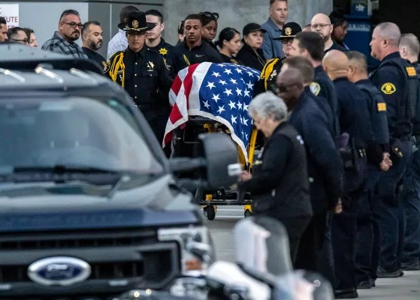 Officers paying respect at memorial