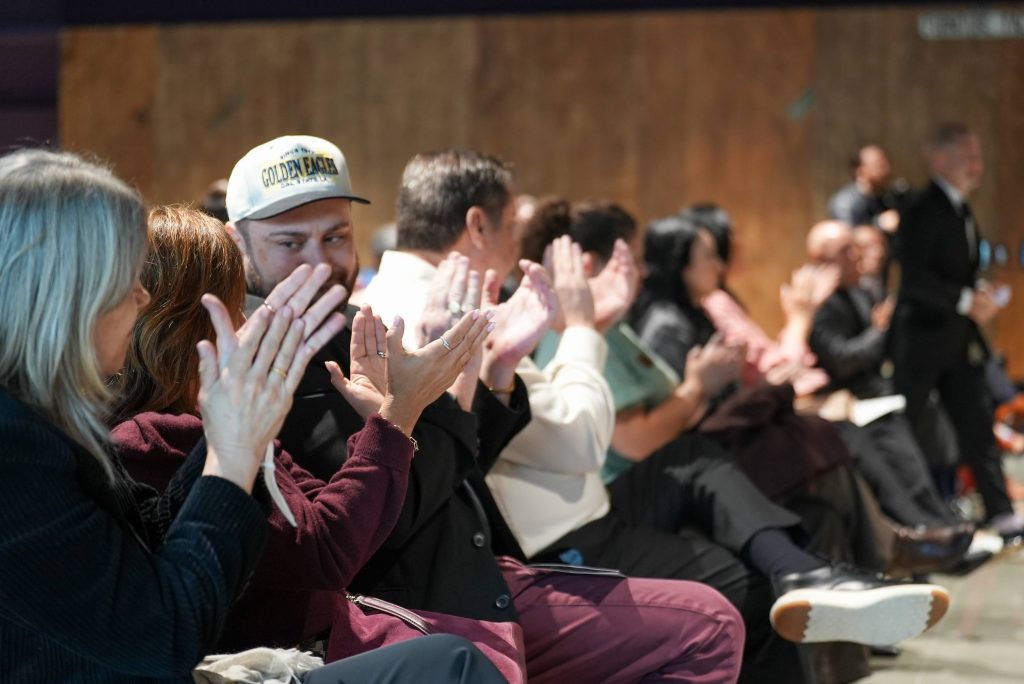 Crowd celebrating the inaugural cohort of students pursuing bachelor’s degrees through California State University, Los Angeles at San Quentin Rehabilitation Center
