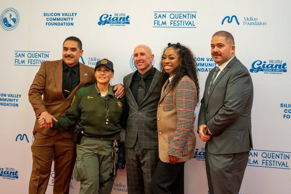 San Quentin Film Festival group at step and repeat