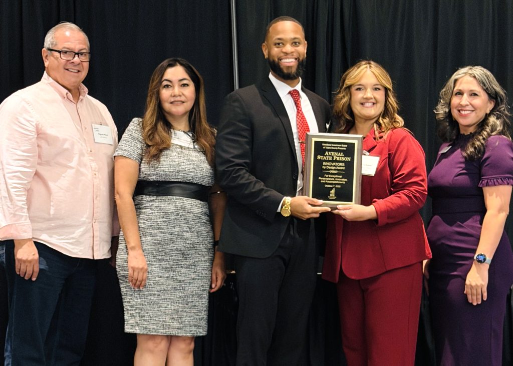 Avenal State Prison Health Care accepting the Innovators by Design Award from the Workforce Investment Board of Tulare County