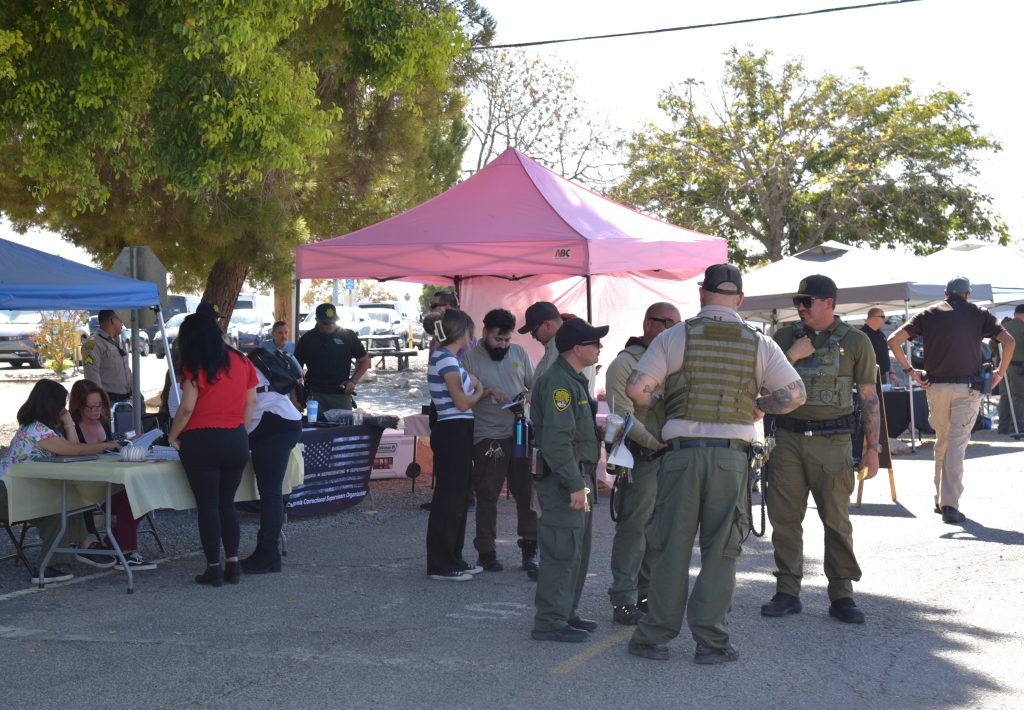 Booth with a pink tarp at Avenal State Prison's staff health fair.