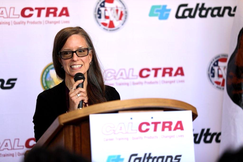Suzie Changus, CALCTRA Director, speaks at the CIM ribbon-cutting event.