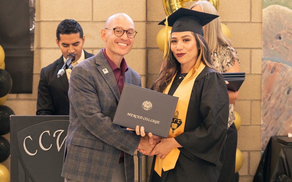 Pineda graduates Merced College at CCWF.