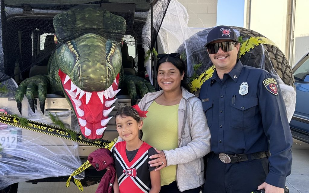 Family standing in front of a T-Rex at CTF-Soledad.