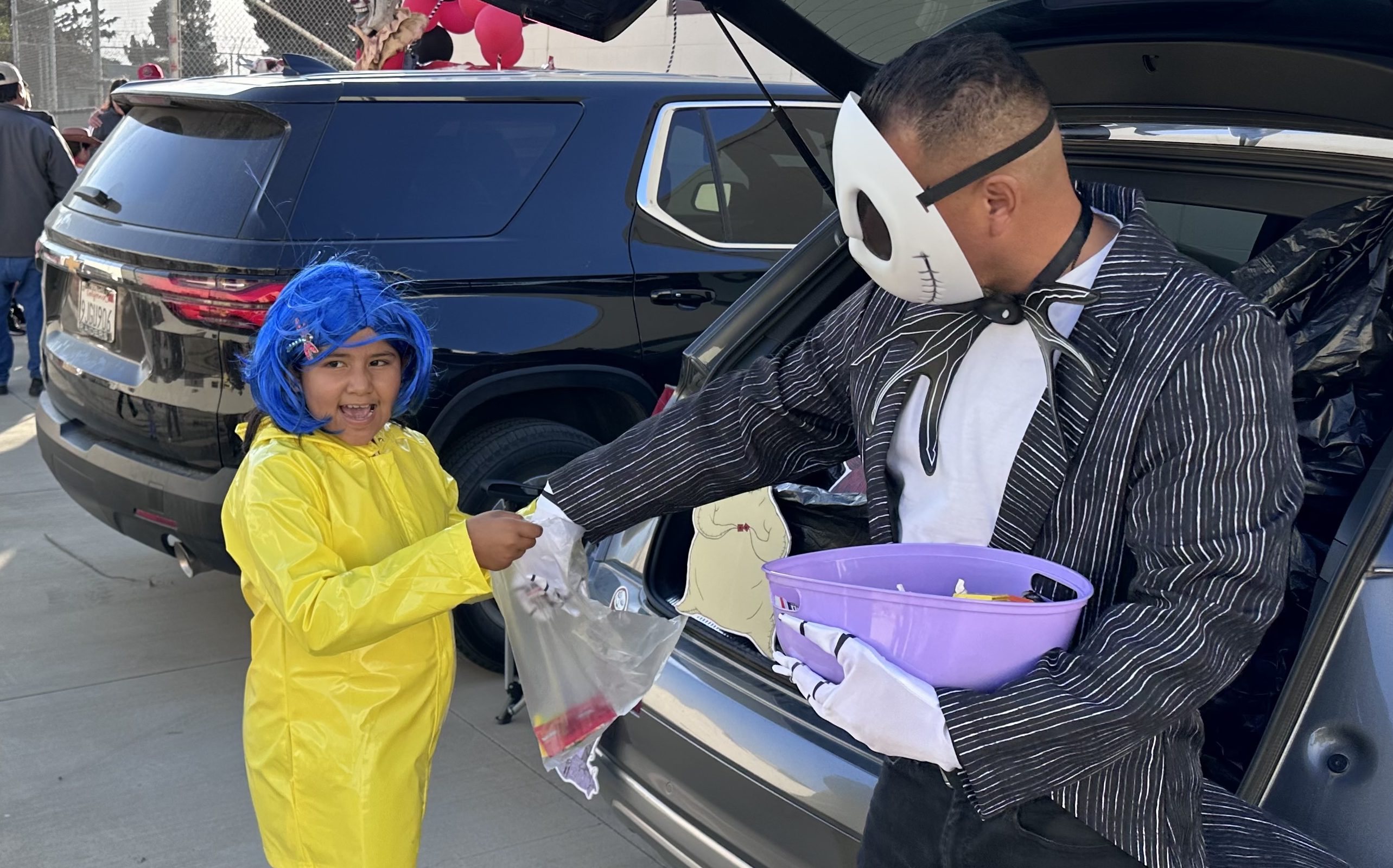 A little Coraline-costumed kid receives treats during an early Halloween event at CDCR Correctional Training Facility at Soledad.