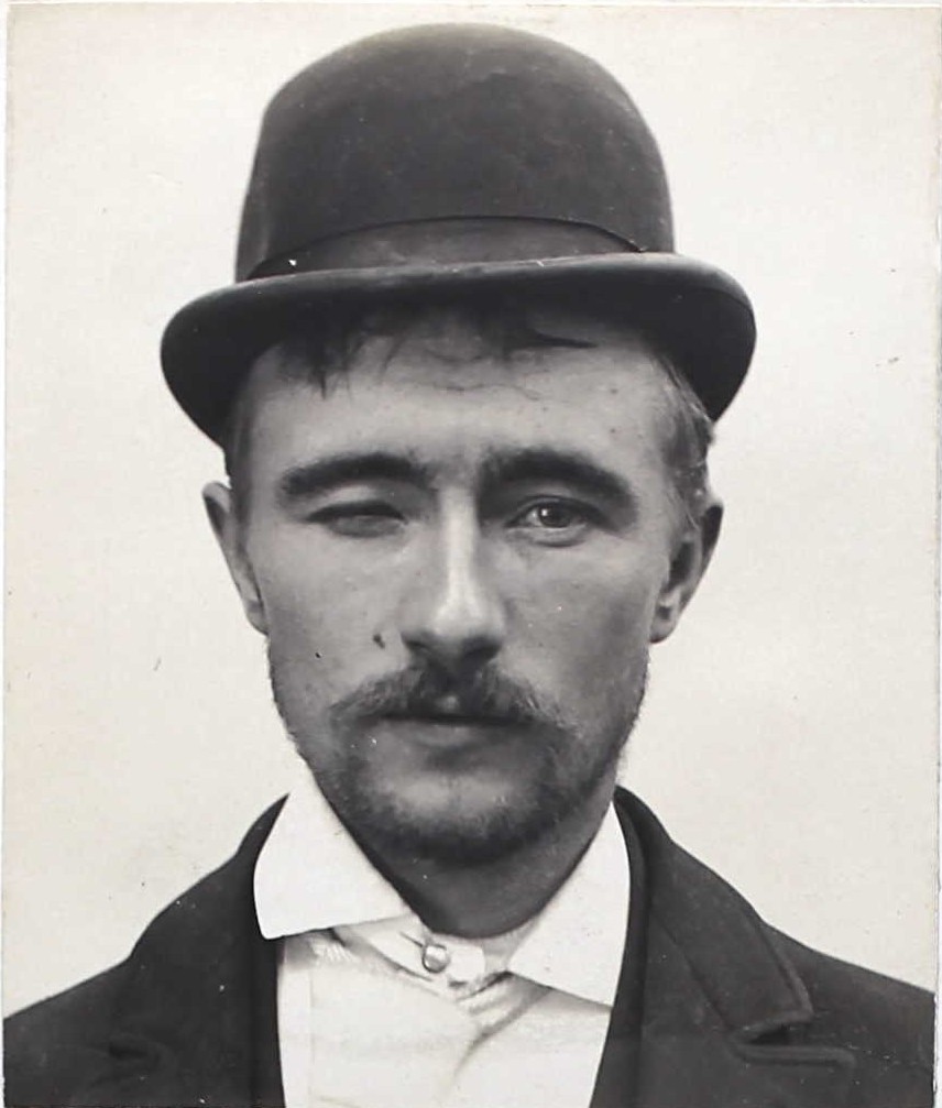 William Fredericks, wearing a hat, at San Quentin in 1894 under number 15690.