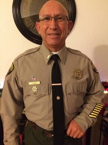 Carlos Garza, a retired correctional lieutenant, passed away in October 2026.