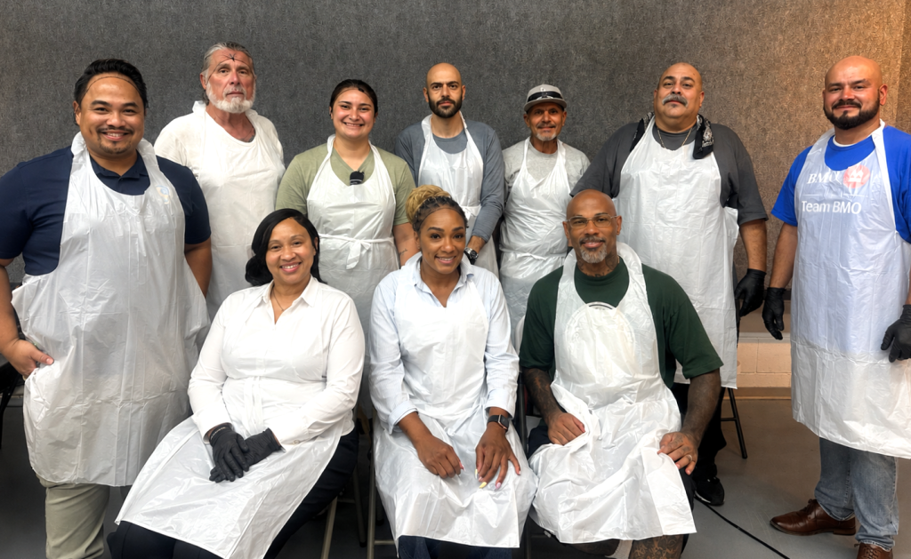 Volunteer group in aprons at Hope the Mission