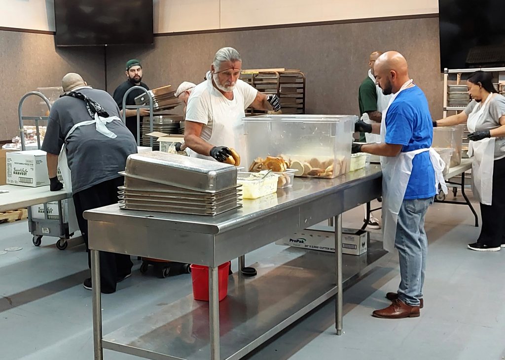 Volunteers in kitchen at Hope the Mission