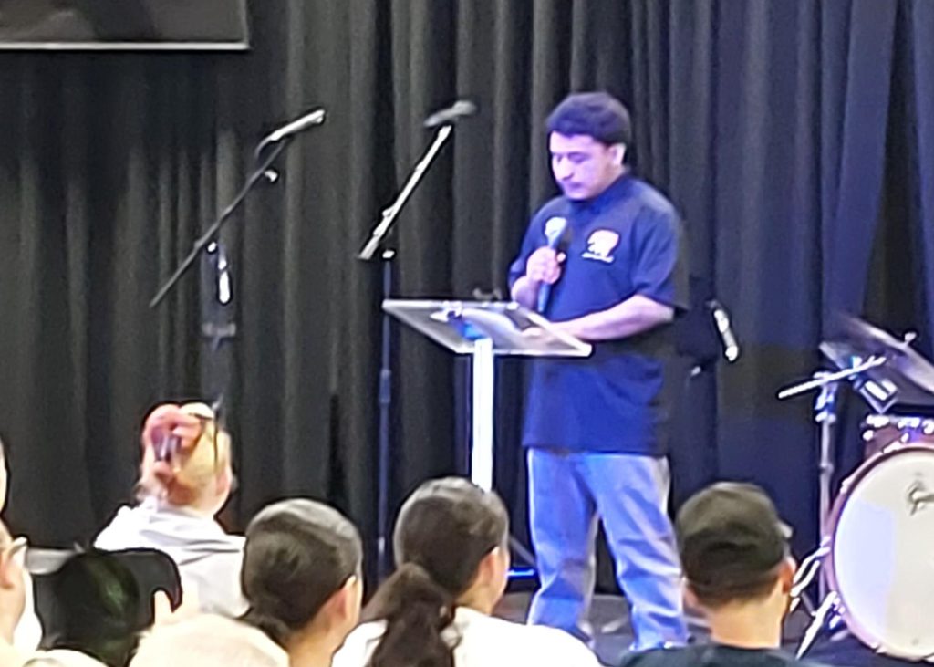 Tellez speaking at podium