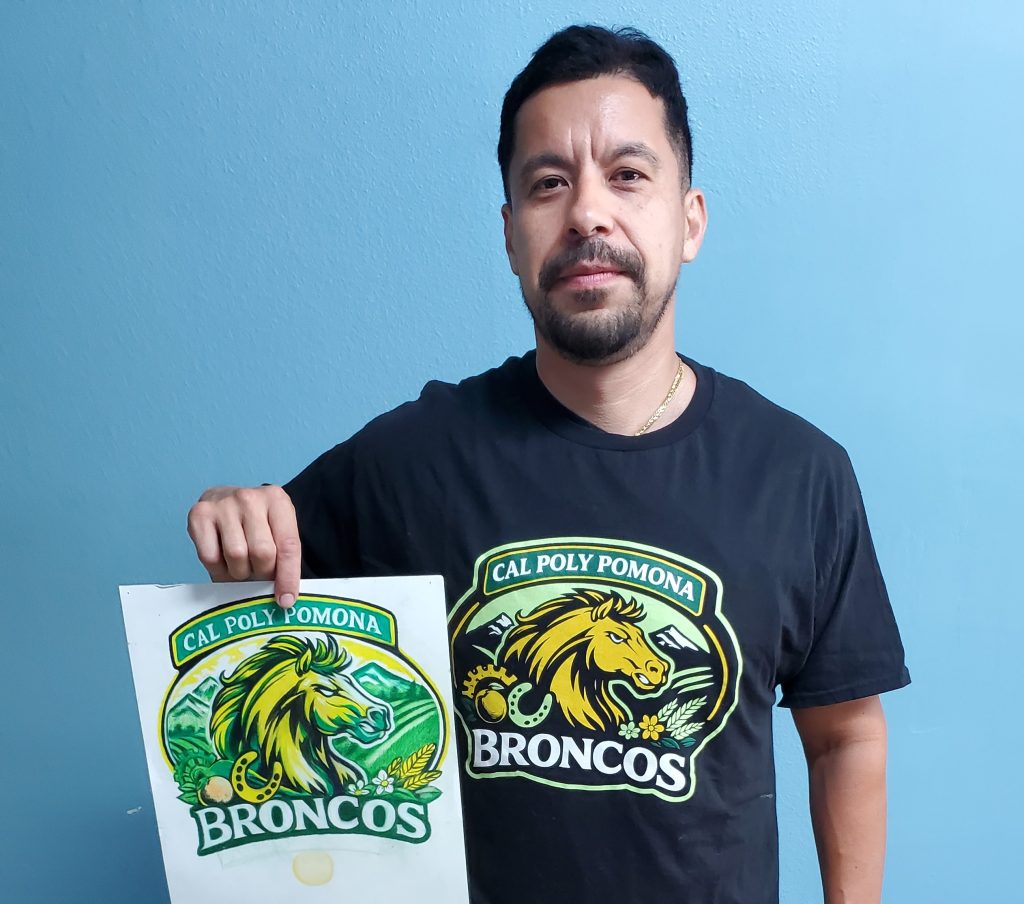 Reentry program participant Angel Paredes with his winning design.