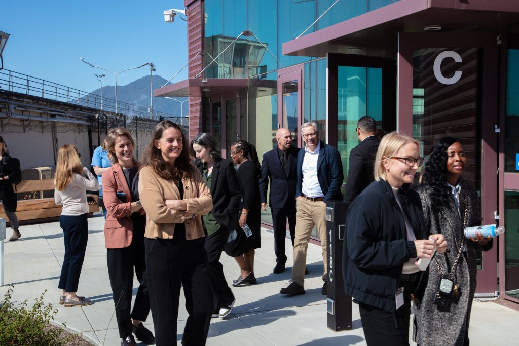 People tour the SQ Learning Center in September 2026.