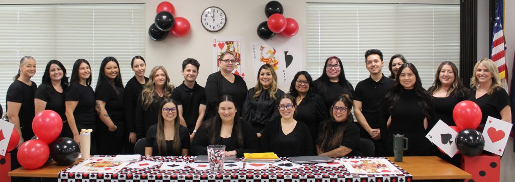 Group photo of staff members sitting at a table for a health fair at Pleasant Valley State Prison (PVSP) in Coalinga, California, September 2026.