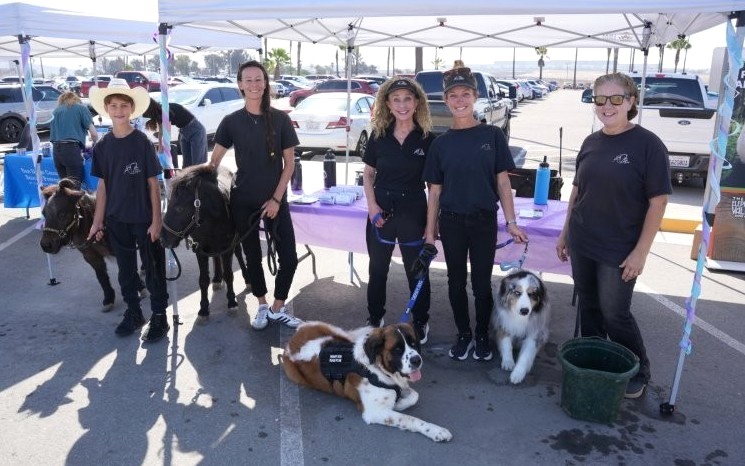 People holding therapy animals at RJD.