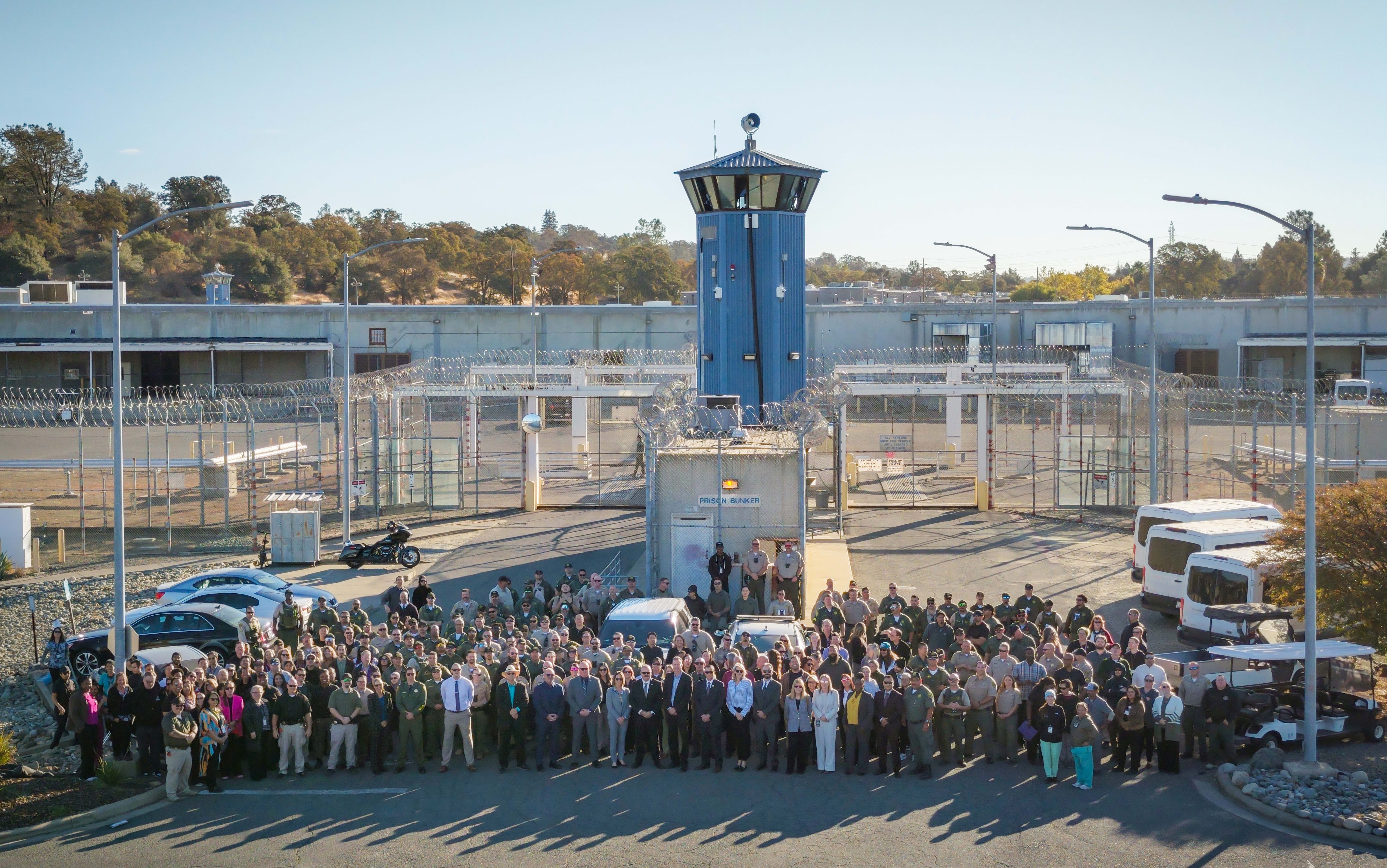 CSP-Sacramento staff gather in front of the institution for a group photo with CDCR and CCHCS executives to celebrate 40 years of public safety. The institution was activated in 1986.