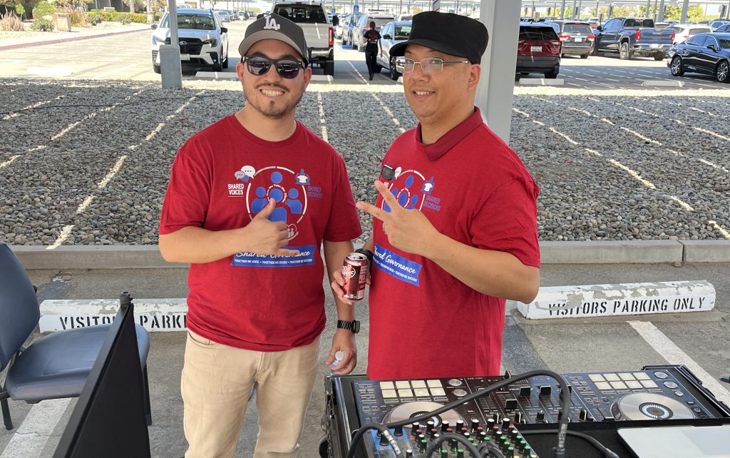 Two staff members acted at DJs at the health fair at WSP-RC.