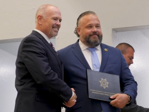 Parole Agent Kyle Kesteloot with Director Bryan Bishop.