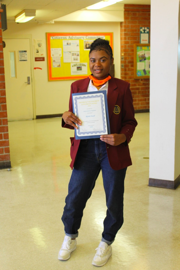 DJJ Youth Myesha with Scholarship Award