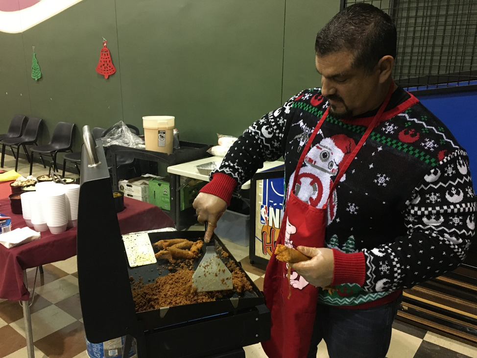 Chad Asst. Superintendent Juan Guajardo prepares chorizo for omelets. 