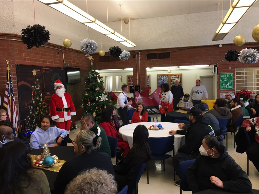 Staff at Ventura enjoy holiday music while waiting to be served brunch by DJJ managers, executives and chaplains on December 15, 2022