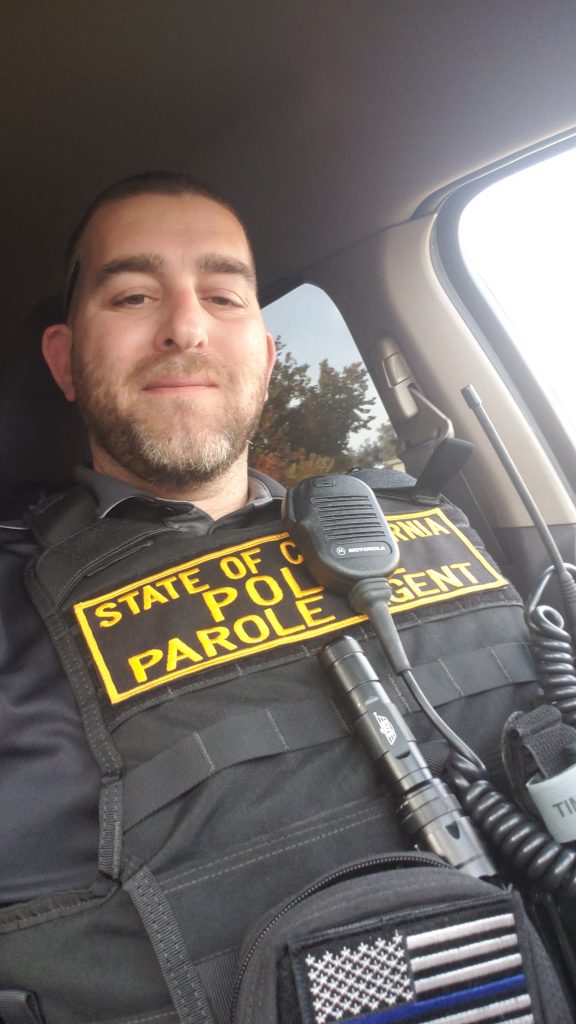 A parole officer in his vehicle.