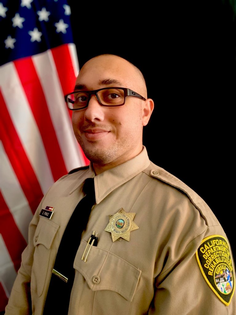 A correctional officer in uniform.