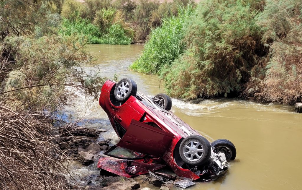 A car overturned in a canal.