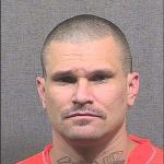 inmate Jason Kohr is a white male, 5 feet, 10 inches tall, weighing 187 pounds with hazel eyes and a shaved head.