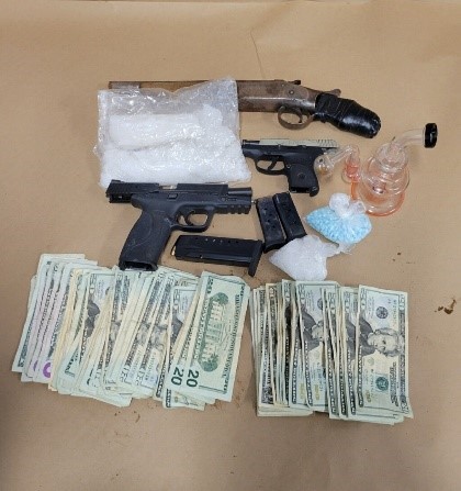 Execution of warrant results in arrest, seizure of drugs and weapons