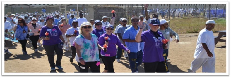 Staff, Volunteers, and Incarcerated individuals walk the "Cancer Survivor" walk