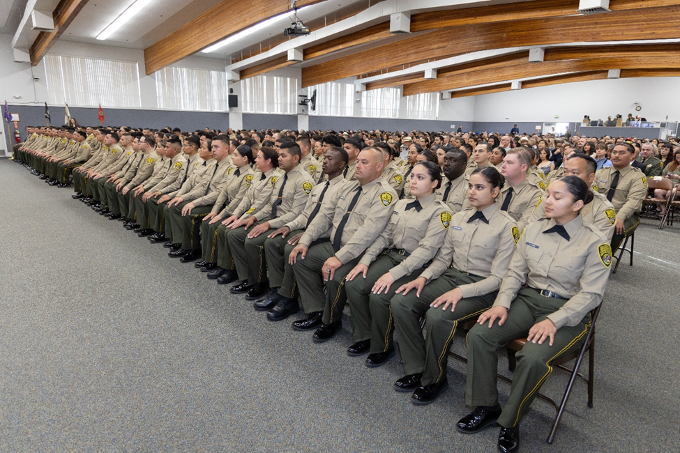 Graduates sitting in line
