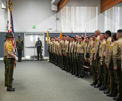 Picture of color guard in front of the graduating class