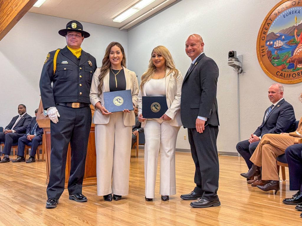 New parole agents Galindo and Gomez posed with certificates