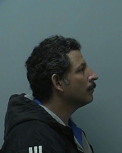 Side mugshot image of Ramon E Rivera