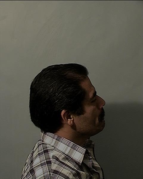 Side mugshot image of Alberto Samudio Pena