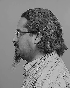 Side mugshot image of Atilano Louis Gutierrez