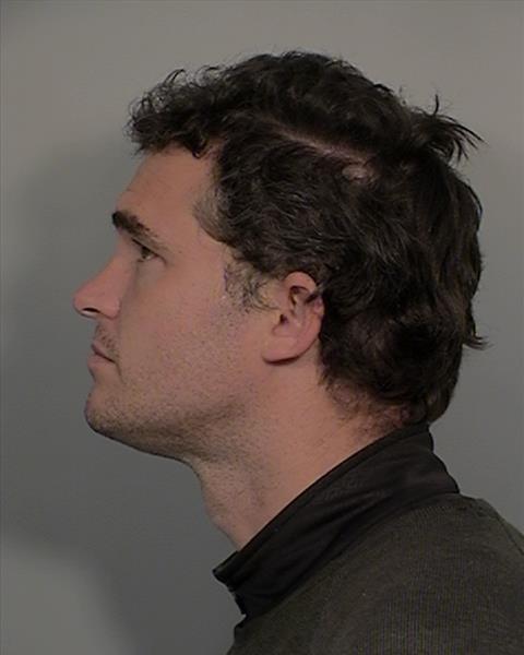 Side mugshot image of Justin Paul Carman
