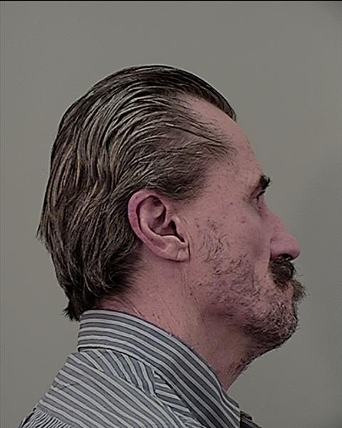 Side mugshot image of Curtis Eugene Schiess