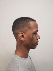 Side mugshot image of Cory Jamaal Thompstron