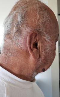 Side mugshot image of Rodolfo  Roman