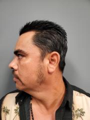 Side mugshot image of Jesus Eladio Alba