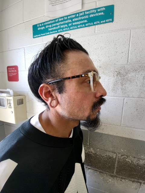 Side mugshot image of Isidro Junior Toscano